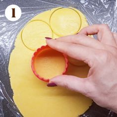 a person is making an object out of dough