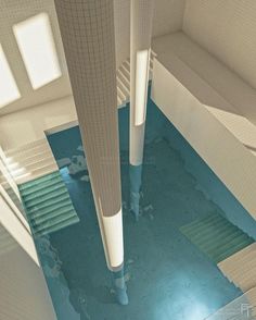 an aerial view of the inside of a building with blue flooring and white walls