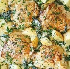 a casserole dish with chicken, potatoes and spinach