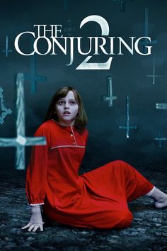 the poster for conjuring 2, which features a woman in a red dress