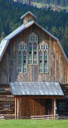 an old wooden building with stained glass windows