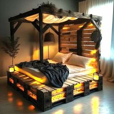 a bed made out of pallets with lights on the sides and pillows under it