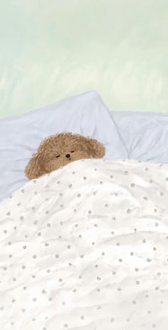 a brown teddy bear laying on top of a bed covered in white sheets and polka dots