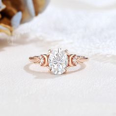 Inspired by the ethereal glow of the moonlight, this engagement ring is a combination of the 6x8mm oval shaped gorgeous moissanite and the crescent moon motifs. The cluster moissanite shines with a mesmerizing glow, it creates a mesmerizing design that celebrates both the beauty of nature and the magic of romance.   Engagement Ring Detail  * Center stone: Moissanite * Size: 6x8mm, oval cut * Side stones: Moissanite * Shape: round shaped * Weight: 0.04ctw | D Color VVS Clarity * Band width: 1.5mm WHY IT WILL BE YOUR CHOICE  ❀ An exquisite jewelry gift with sentimental value for your cherished ones. ❀ Elegantly customized and prepared for any significant event. ❀ Crafted from ethically sourced and premium materials. ESSENTIAL INFORMATION 🚚: It usually takes 2-4 weeks to make and 3-6 days to Celestial Wedding Ring, Moon Engagement Ring, Celestial Wedding, Detailed Engagement Ring, Ring Promise, Rings For Women, Exquisite Jewelry, Engraved Rings, Ring Sterling Silver