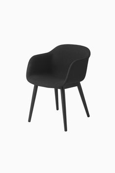 a black chair with wooden legs on a white background in the style of an armchair