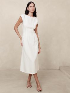 We reimagined the classic shift dress in a luxurious certified European linen, a fabric we love for its lived-in look and its ability to stay cool and crisp even in heat and humidity.  Here, we added subtle cap sleeves and darts to shape the waist for an almost corset-like silhouette.  Fit and flare.  Crew neck.  Invisible zip at back.  Unlined.  Fit and flare.  Short sleeves.  Midi length.  Model: Size 2, 5'10" (178cm). White Linen Dresses, Linen Midi Dress, Grad Dresses, Banana Republic Dress, 2024 Fashion, White Midi Dress, Classy Dress, Cocktail Dress Party, Fit And Flare