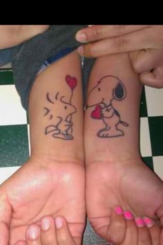 two people with matching tattoos on their arms