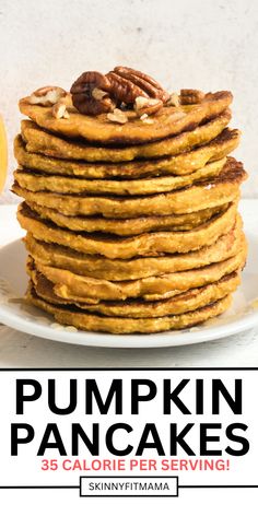 pumpkin pancakes stacked on top of each other with pecans in the middle and text overlay that reads, pumpkin pancakes 35 calorie per serving