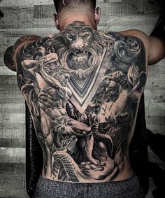 a man with tattoos on his back