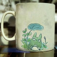 a coffee mug with an image of a monster on it