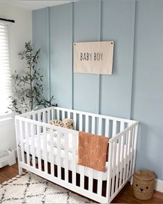 Baby boy nursery! Light blue, board and batten, sunshine theme, nursery, olive branch tree, small nursery, small nursery layout, small nursery design, baby, baby boy, teddy bear theme, white crib, small cribs, small crib, wall treatment, rattan basket, pottery barn, home style, home decor, interior design, nursery design Blue For Nursery, Blue And Rust Nursery, Baby Blue Boy Nursery, Baby Boy Nursery White Crib, Blue Boys Nursery, Boys Nursery Blue, Dusty Blue Accent Wall Nursery, Blue Wallpaper Nursery