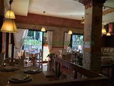 an empty restaurant with tables and chairs