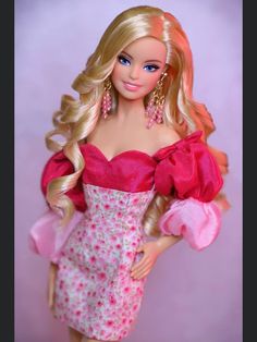 a barbie doll with blonde hair and pink dress