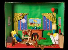 a doll house with furniture and accessories in it's display case on the floor