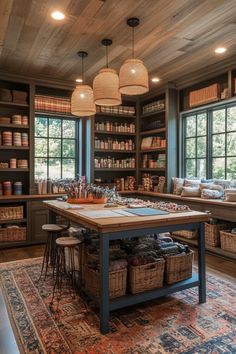 a large room with lots of bookshelves and baskets on the table in front of it