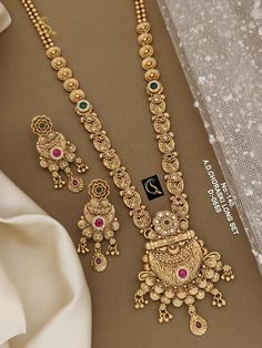 Description :- Gold paisley design necklace set/dainty gold plated necklace/one gram gold necklace set/Indian jewelry set Gift yourself a royal look with this perfectly crafted necklace set from Manalisstudio. Crafted with high quality CZ stones, it is impressive in design. The green enamel artwork adds perfect texture to the design. Perfect for weddings and festivities, this antique necklace set should be put on with your favorite sari or lehenga. 100% Satisfaction. Long Lasting Plating, High-Q Long Gold Necklace Designs Latest, Traditional Gold Hand-set Diamond Necklace, Traditional Gold Bridal Necklace With Dual-tone, Elegant Hand-set 22k Gold Bridal Necklace, Traditional Hand-set Yellow Gold Bridal Necklace, Traditional Gold Bridal Necklace With Multi-stone, Gold Jewellry, Necklace Set Indian, Gold Long Necklace