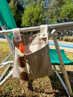 a bag hanging from the back of a lawn chair