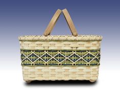 a woven basket with wooden handles on a white background