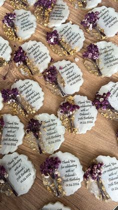 many flowers are placed on top of each other with names and date cards attached to them