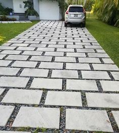 a car parked on the side of a driveway