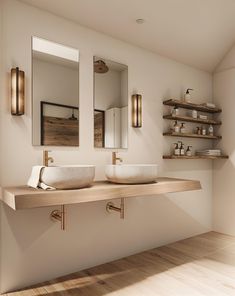 two sinks in a bathroom with wooden shelves