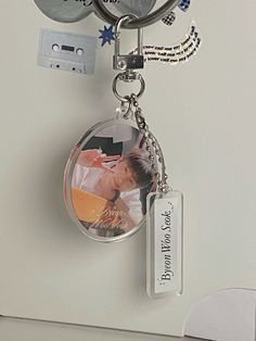 a keychain with a photo attached to it