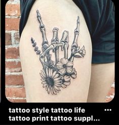 a tattoo with flowers on it and the words tattoo style tattoo life written in black ink