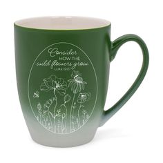 a green and white coffee mug with the words, consider how the wildflowers grow