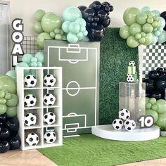 a soccer themed party with balloons and decorations