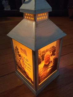 a lantern that has pictures on it