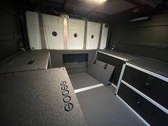 the interior of an empty vehicle with cabinets and counters in place for people to use