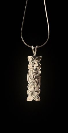 "Solid .925 Sterling Silver Hawaiian Heirloom Plumeria Pua Melia Scroll Necklace. The size is 38MMx10MM, about 1.5\" long. FREE Sterling Silver Italian Snake Chain w/lobster claw clasp included in your choice of length. This labor-intensive design is always a bestseller in our Hawaii stores. --This design features a Plumeria Flower Scroll. This iconic Flowers bright colors, beautiful shape and amazing scent greet you on a daily basis in the Islands. Often used in Lei making, it is worn and excha Lei Making, Hawaiian Heirloom Jewelry, Jewelry Closet, Hawaiian Necklace, Hawaii Jewelry, Tropical Jewelry, Island Jewelry, Preppy Jewelry, Heritage Jewellery