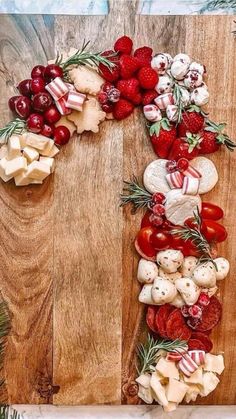 a wooden table topped with lots of different types of food on top of each other