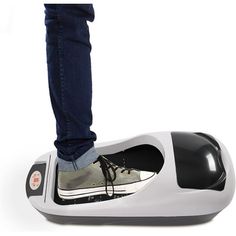 a person standing on top of a white and black shoe shaped device with one foot in the air