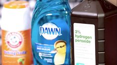 two bottles of dawn and hydrogen peroxide on a counter