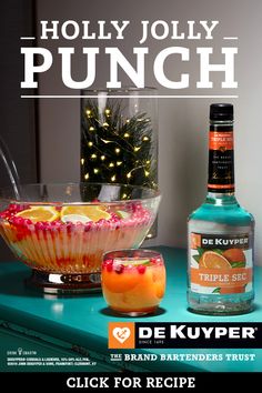 an advertisement for a holiday punch with oranges and cranberries in a bowl