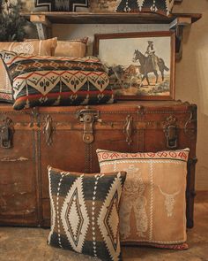 an old suitcase with pillows and pictures on it