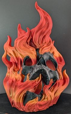 a fire skull sculpture sitting on top of a table