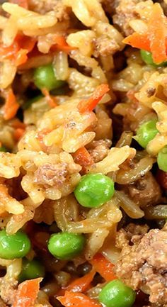 rice with meat and peas is shown in a bowl, ready to be eaten for lunch