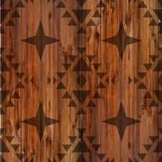 an image of wood with star designs on it in brown and black colors that are very similar to the same pattern