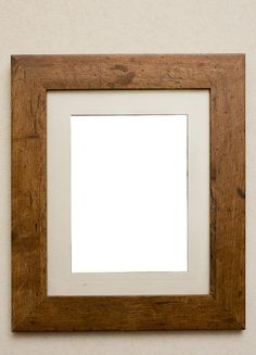 a wooden frame with a white square in the middle