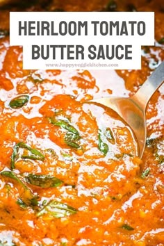 a close up of a spoon in a bowl of food with the words heir tomato butter sauce