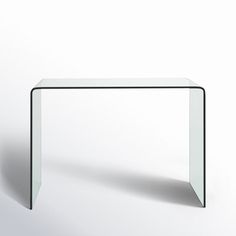 a glass table sitting on top of a white floor