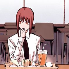 a person sitting at a table with food and drinks