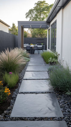 an outdoor patio area with gravel and plants