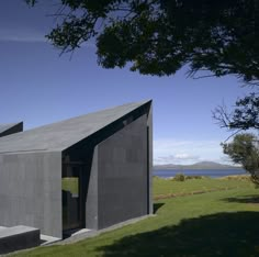 the house is made out of concrete and has a sloping roof