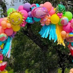 an arch made out of balloons and streamers