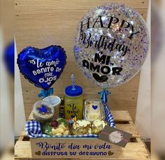 a birthday gift basket with balloons and confetti for someone special day or other special occasion