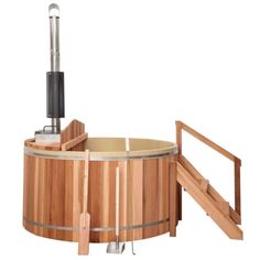 a wooden hot tub sitting on top of a white floor next to a hand rail