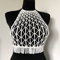 Macrame Handmade Top - a white masterpiece designed for parties, beach celebrations, vacations, and festival looks. This versatile top is your ideal choice for making a statement at any festive occasion, providing the perfect blend of style and comfort. Elevate your wardrobe with this must-have piece, also perfect as a festival white top for those special moments. Information: * Material: polyester cord. * Color: white - ready to ship.  * Size: s-m size * Handmade by myself in Lithuania, Europe. White Sleeveless Crop Top For Party, White Beachwear Tops For The Beach, White Beachwear Tops For Beach, Summer Party Sleeveless Crochet Top, Hippie Crop Top For Summer Festival, Summer Sleeveless Crochet Party Top, Fitted Crop Top For Summer Beach Cover-up, Summer Sleeveless Crochet Top For Party, White Crochet Top For Summer